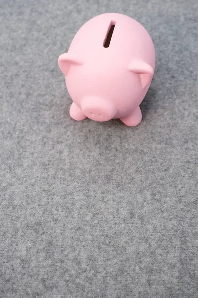 Cute Simple Pink Piggy Bank Gray Woolen Background — Zdjęcie stockowe