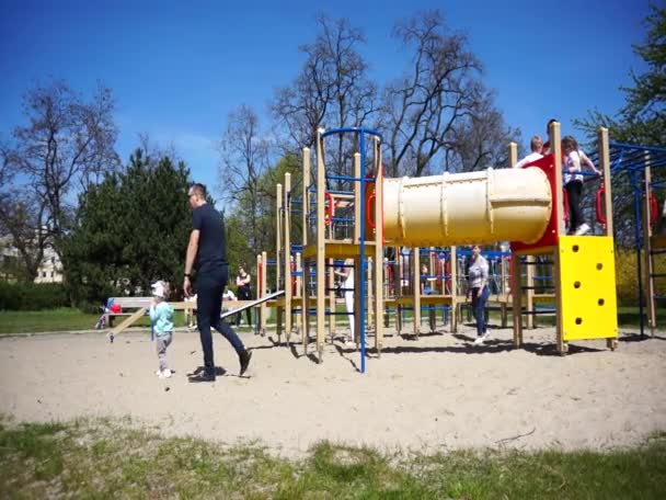 Adults Kids Playing Equipment Playground Sunny Warm Spring Day — Stock Video
