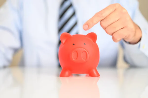 Businessman Pointing Red Piggy Bank Money Savings Investment Concept — Fotografia de Stock