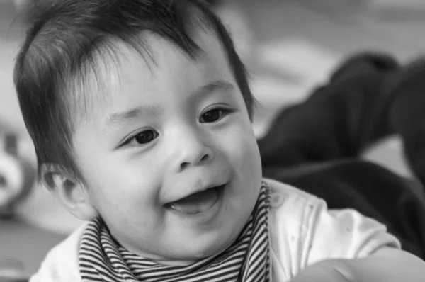 Grayscale Shot Cute Smiling Swiss Baby Boy Playing Toys Rubber — стоковое фото