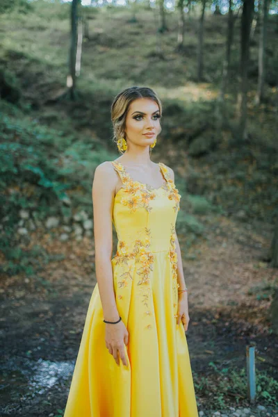 Vertical Shot Young Blonde Female Posing Yellow Floral Evening Dress — стоковое фото