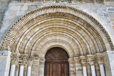The door and facade of the ancient 12th century Parish Church San Juan Evangelista in Valladolid clipart