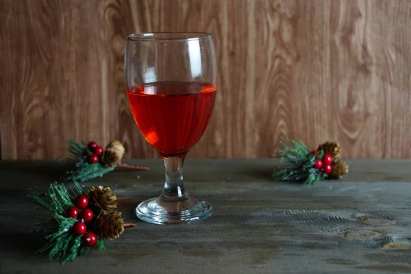 Closeup Glass Red Wine Table Decorative Holly Berries — 스톡 사진