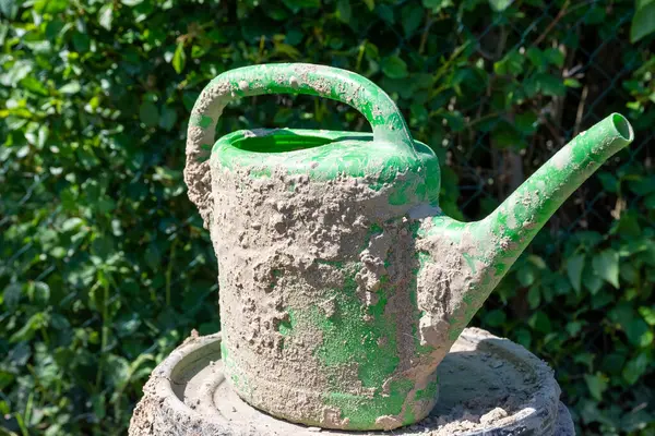 Closeup Shot Green Plastic Watering Can Dried Soil — Stock fotografie