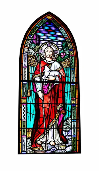 The Jesus Good Shepherd stained on a glass window isolated on a white background