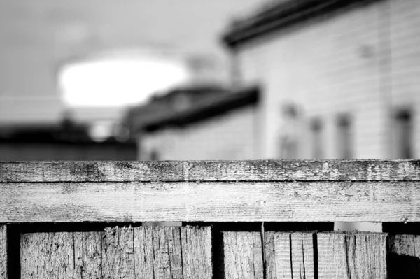 Selective Focus Shot Old Wooden Fence Houses Background — Stock Photo, Image