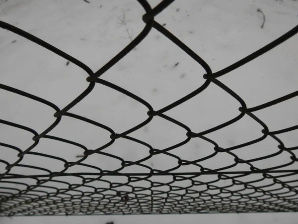 Closeup Metallic Mesh Fence Snowy Ground — 스톡 사진