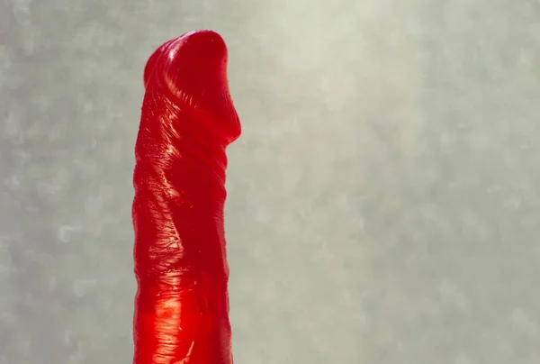 Vibrador Rojo Hecho Gel Sobre Fondo Gris —  Fotos de Stock