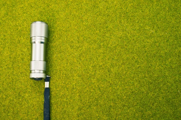 Top View Shot Flashlight Green Grass Surface — Stock Photo, Image