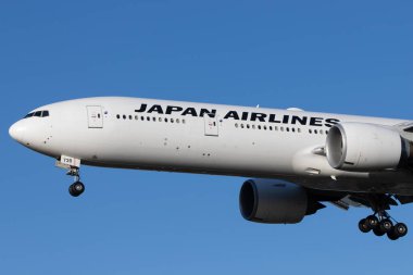 LONDON, UNITED KINGDOM - Feb 11, 2020: Japan Airlines (JL / JAL) approaching London Heathrow Airport (EGLL/LHR) with a Boeing B77W (JA739J/32437). clipart
