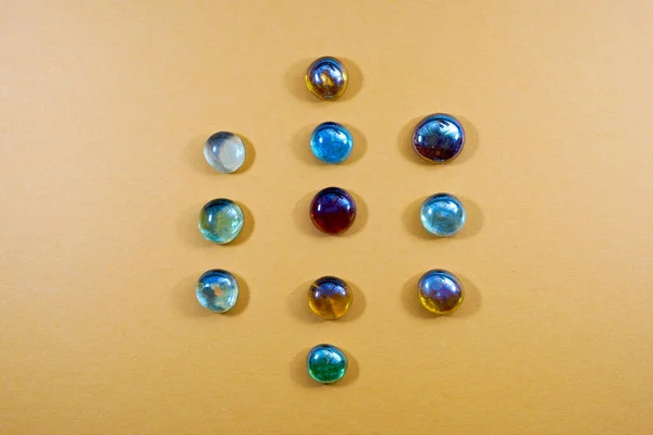 Top View Colorful Glass Stones Yellow Background — Φωτογραφία Αρχείου