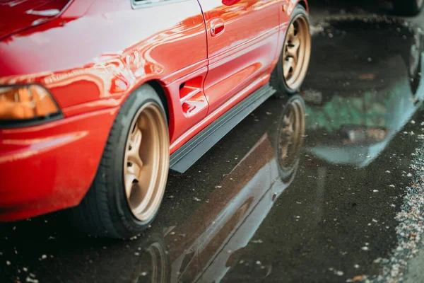 Side View Red Coupe Sports Car Reflection Wet Asphalt — Φωτογραφία Αρχείου