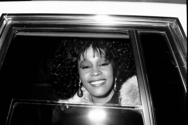 LOS ANGELES, UNITED STATES - Jan 06, 1987: 19th Annual NAACP Image Awards (1987) - Whitney Houston pulls over after photographer Ray Johnson (18 years of age), chases down limo after leaving.