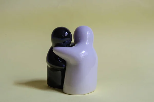 Two Black White Ghost Figurines Hugging Each Other — Zdjęcie stockowe