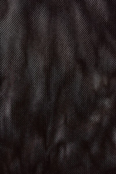 Pionowe Ujęcie Czarnej Tkaniny Siatkowej Wzór Tekstury — Zdjęcie stockowe