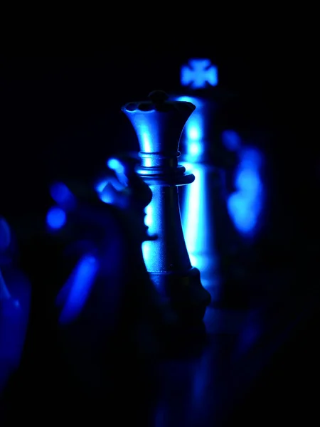 Selective Focus Shot Queen Chess Piece Illuminated Blue Light Dark — Stock Photo, Image