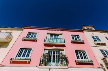 A low angle shot of a building in Ericeira, Portugal clipart