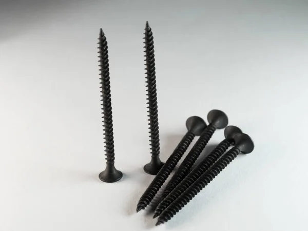 Closeup Shot Black Lag Screws White Surface — Stock Photo, Image