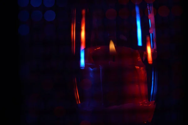 Lit Candle Glass Colorful Shadows Dark — Stock fotografie