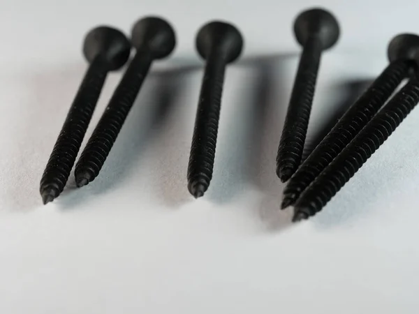 Closeup Long Black Screws Isolated White Surface — Stock Photo, Image