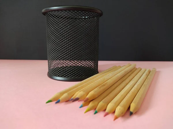 Black Metal Pen Holder Colored Pencils Pink Surface — 스톡 사진