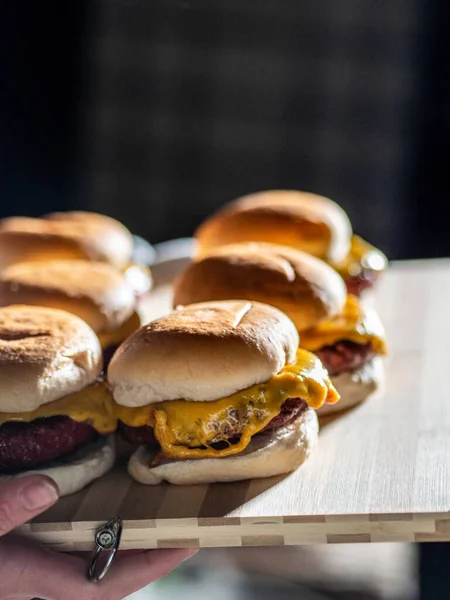 Vertical Shot Some Cheeseburgers Wooden Board — Stock Photo, Image