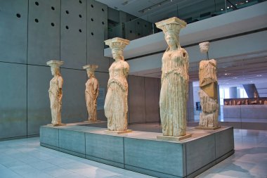 The authentic Caryatids live in the Museum of Athens under the hill of the Acropolis, Athens, Greece. clipart