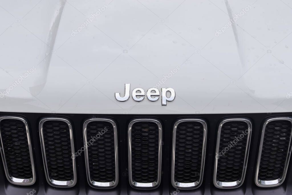 KIEL, GERMANY - May 29, 2021: Closeup of the Jeep logo on a new shiny car front