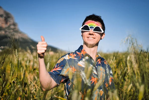 Young Hispanic Male Showing Thumbs His Right Hand Field — Stock Photo, Image