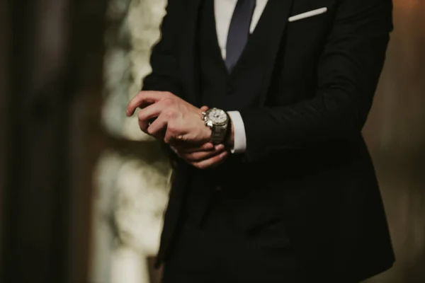 Closeup Shot Man Black Suit Fixing His Watch — Stock Photo, Image