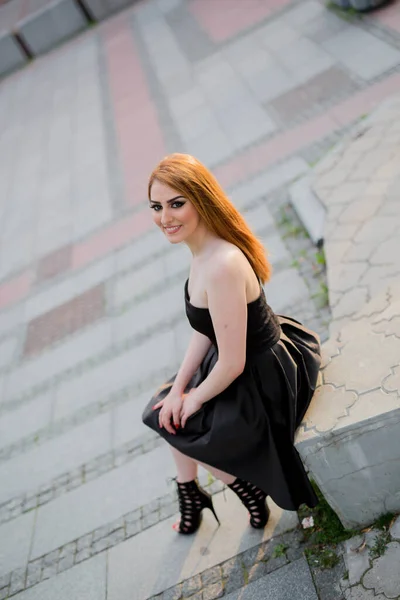 Young Attractive Woman Black Dress Sitting Stone Posing — 스톡 사진