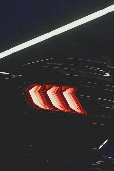 Vertical Closeup Shot Black Sports Car Red Backlight Night — Stock Photo, Image