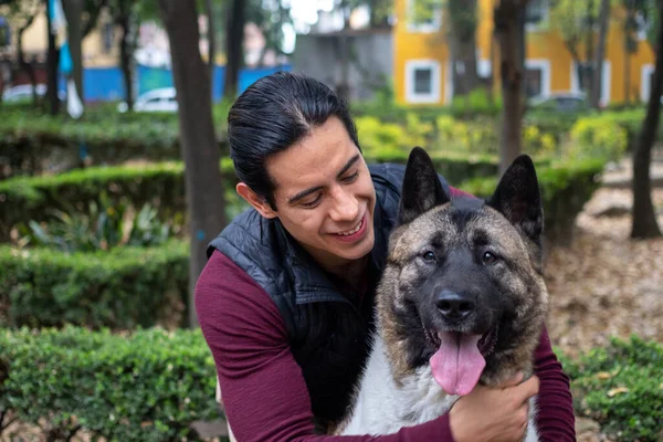 Young Muscular Hispanic Man Holding Petting His Dogs Park — Stock Photo, Image