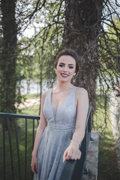 Portrait Smiling Caucasian Woman Wearing Long Gray Dress Leaning Fences — 스톡 사진