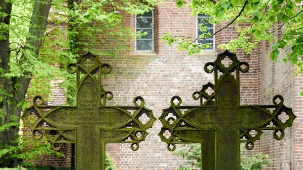 Closeup Orthodox Old Crosses Grave Trees Brick Walled Building Background — Φωτογραφία Αρχείου