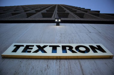 PROVIDENCE, UNITED STATES - Mar 12, 2021: An upward view of the exterior of the Textron World Headquarters building, with the sign. clipart