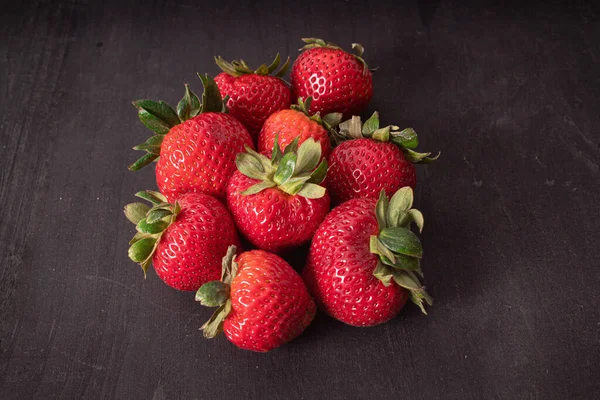 Selective Focus Shot Strawberries Dark Wooden Surface — Zdjęcie stockowe