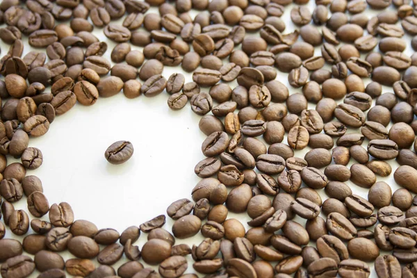 Closeup Roasted Coffee Beans Scattered White Surface — Stok fotoğraf