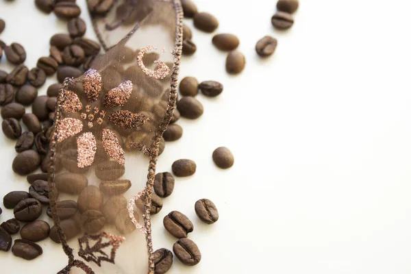 Closeup Lace Ribbon Roasted Coffee Beans White Surface — Foto Stock