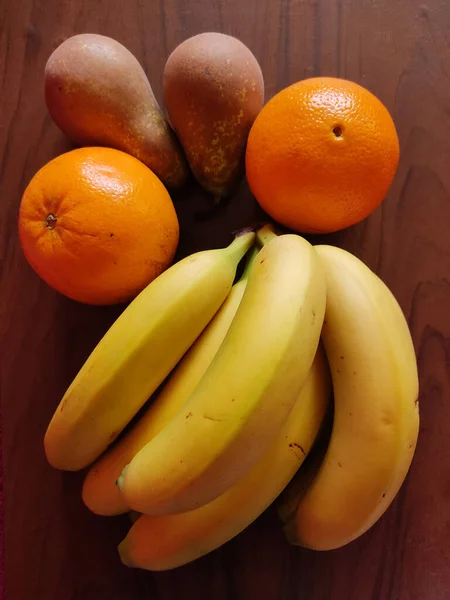 Top View Ripe Bananas Pears Oranges Wooden Surface — Fotografia de Stock