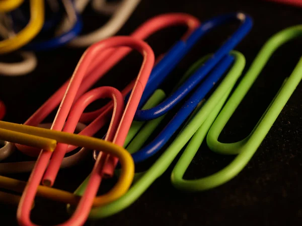 Closeup Colorful Paperclips Scattered Office Table — 스톡 사진