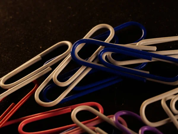 Closeup Shot Colorful Paperclips Dark Table Office — 스톡 사진