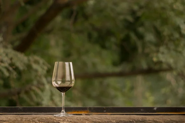Almost Empty Glass Red Wine Put Wooden Window Sill — Zdjęcie stockowe