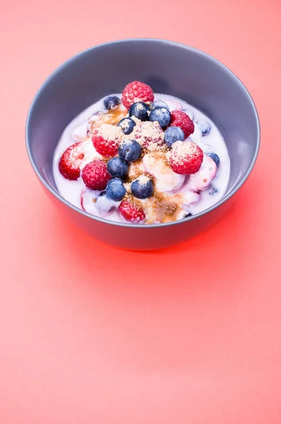 Bowl Yogurt Raspberries Blueberries Powder Isolated Red Background — Stock Photo, Image