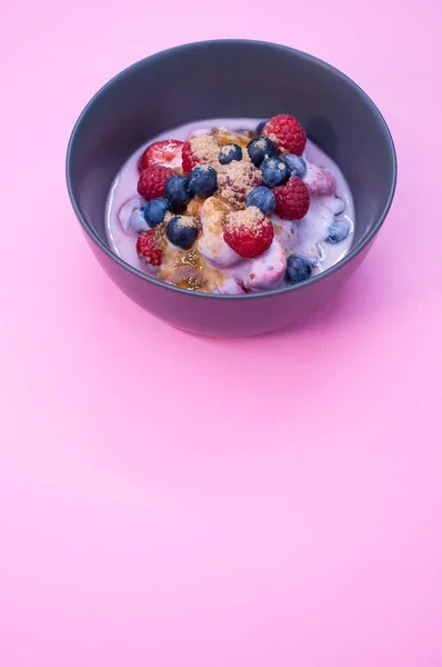 Bowl Yogurt Raspberries Blueberries Powder Isolated Purple Background — Stock Photo, Image