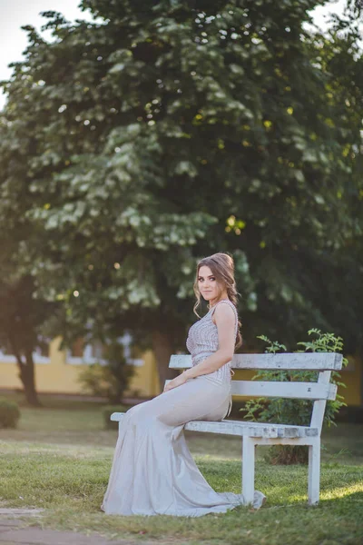 Attractive Caucasian Female Wearing Elegant Long Silver Dress Sitting Bench — Stock Photo, Image