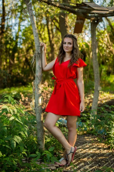 Attractive Caucasian Female Wearing Vibrant Red Dress Posing Background Park — ストック写真