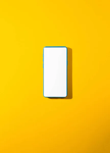 Vertical Shot Blue Smartphone Blank Screen Yellow Background — ストック写真