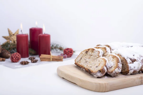 Closeup Shot Sweet Bread Slices Wooden Board Christmas Candles Cones — Zdjęcie stockowe