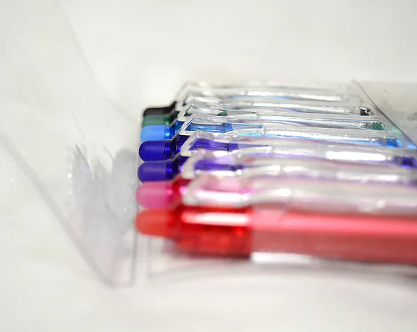 Closeup Colorful Pens Plastic Container White Surface — Stock Photo, Image